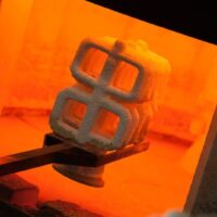 Investment casting nickel-base superalloys for corrosion resistance